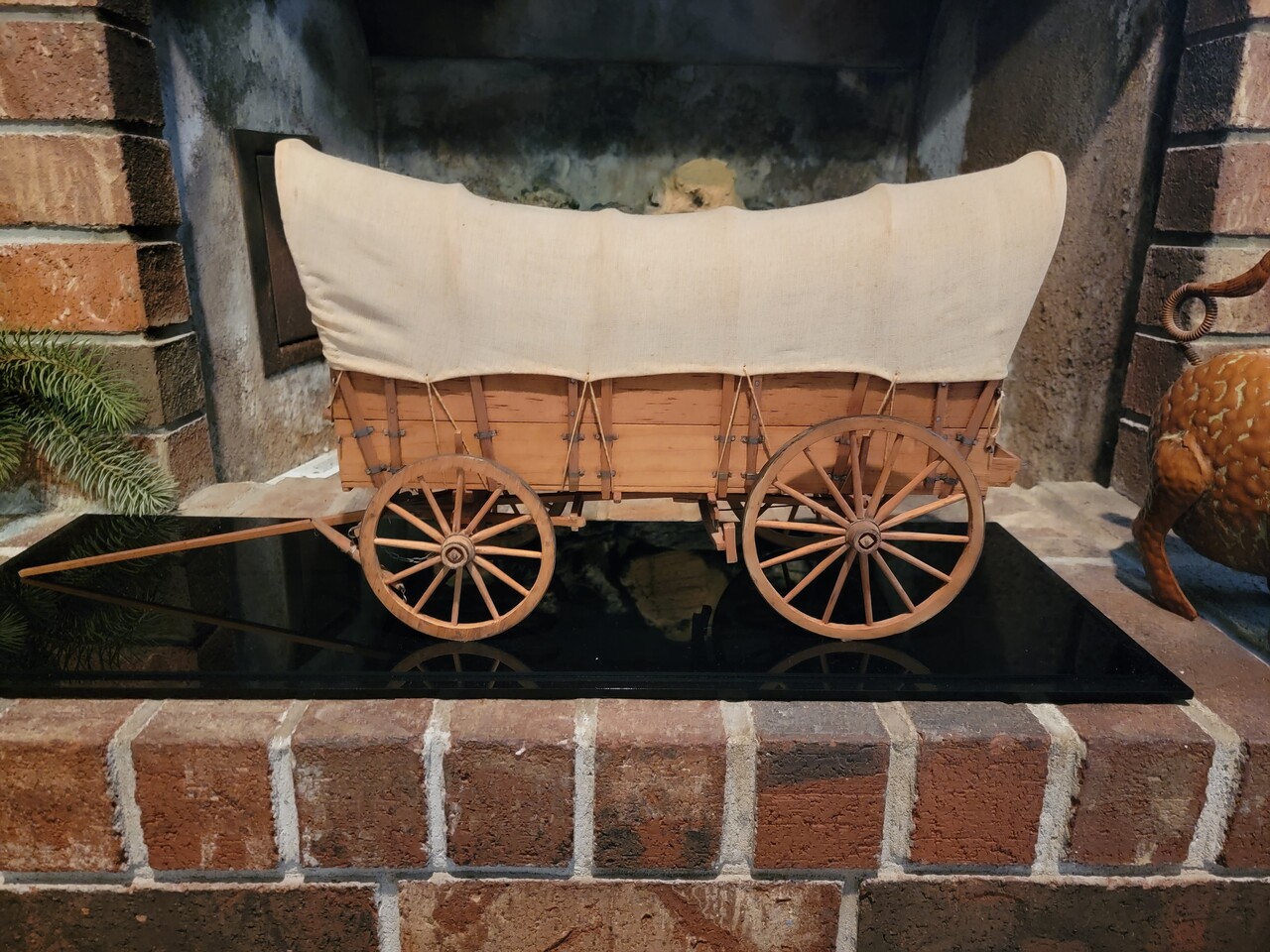 Horse drawn covered wagon.